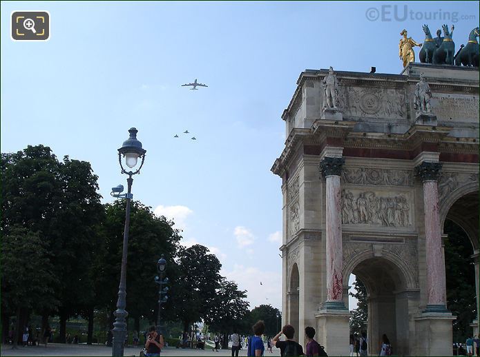 Military fly by at Arc de Triomphe du Carrousel by Louvre Museum