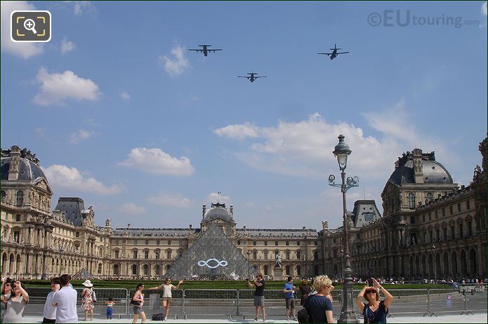 3 military aeroplanes on Louvre fly by