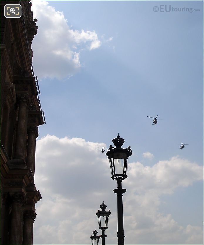 Army helicopters over Louvre lamp posts