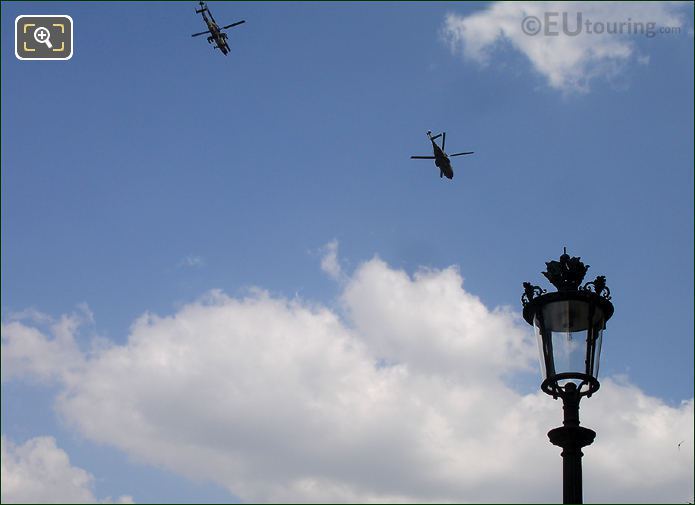 Apache helicopter flying over Louvre