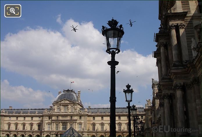 Apache attack helicopters on fly by from Champs Elysees