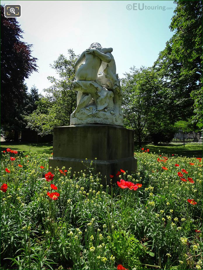 Flowering Iceland Poppy around Joies de la Famille statue, Jardin du Luxembourg