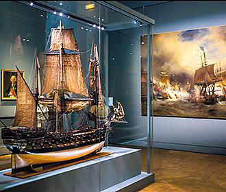 Model boat and large painting at Musee de la Marine