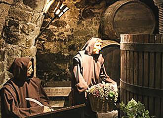 Monks making wine display at Musee du Vin