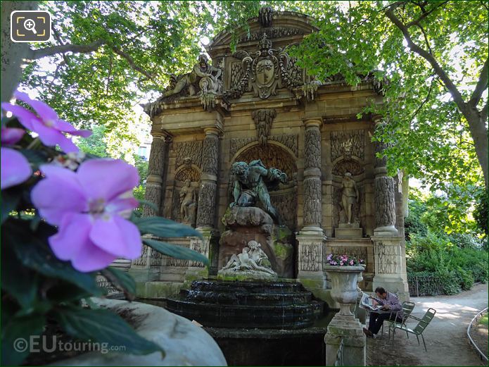 Gentleman reading newspaper by Medici Fountain