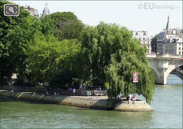 People relaxing along River Seine