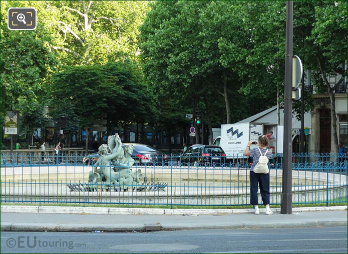 Tourist taking pictures Fontaine du Bassin Soufflot