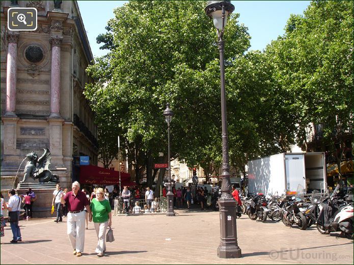 Paris life and dragon fountain at Place Saint Michel