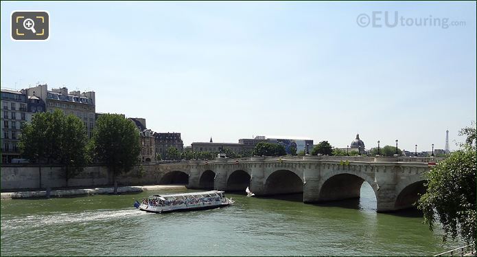 Cruise boat passing under Pont Neuf