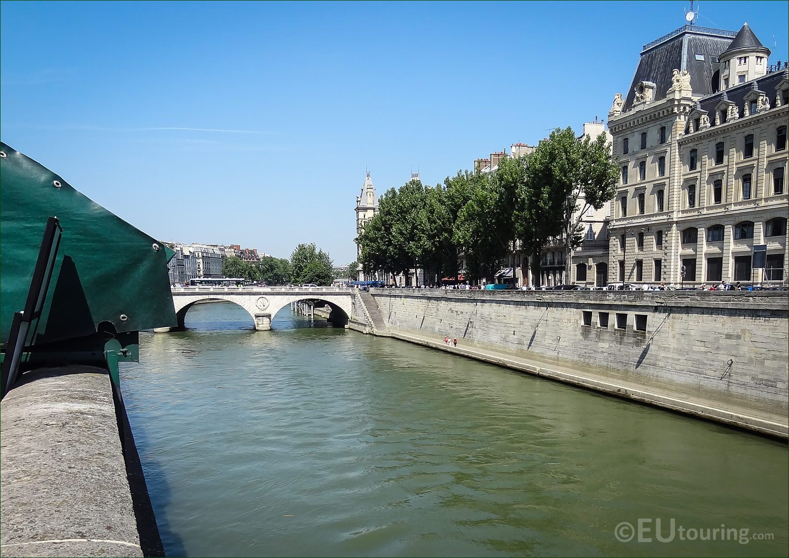 Tourist Boat At Narrow Chanel Near Notre Dame With Bridge Pont Saintmichel  Over River Seine In Paris France Stock Photo - Download Image Now - iStock