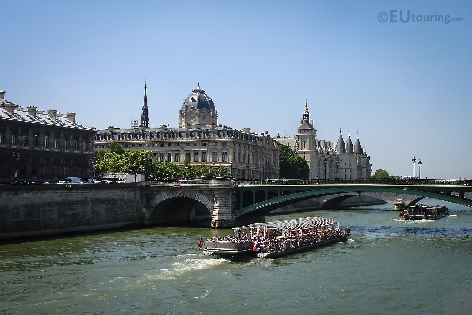 Tourist Boat At Narrow Chanel Near Notre Dame With Bridge Pont Saintmichel  Over River Seine In Paris France Stock Photo - Download Image Now - iStock