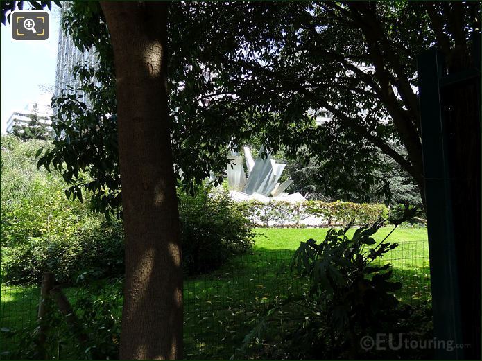 Square Bela Bartok metal water fountain and trees