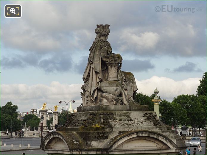 Back and right side of City of Lyon statue in Paris