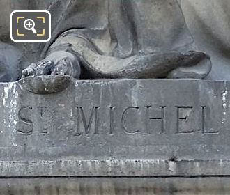 Saint Michel inscribed on statue base