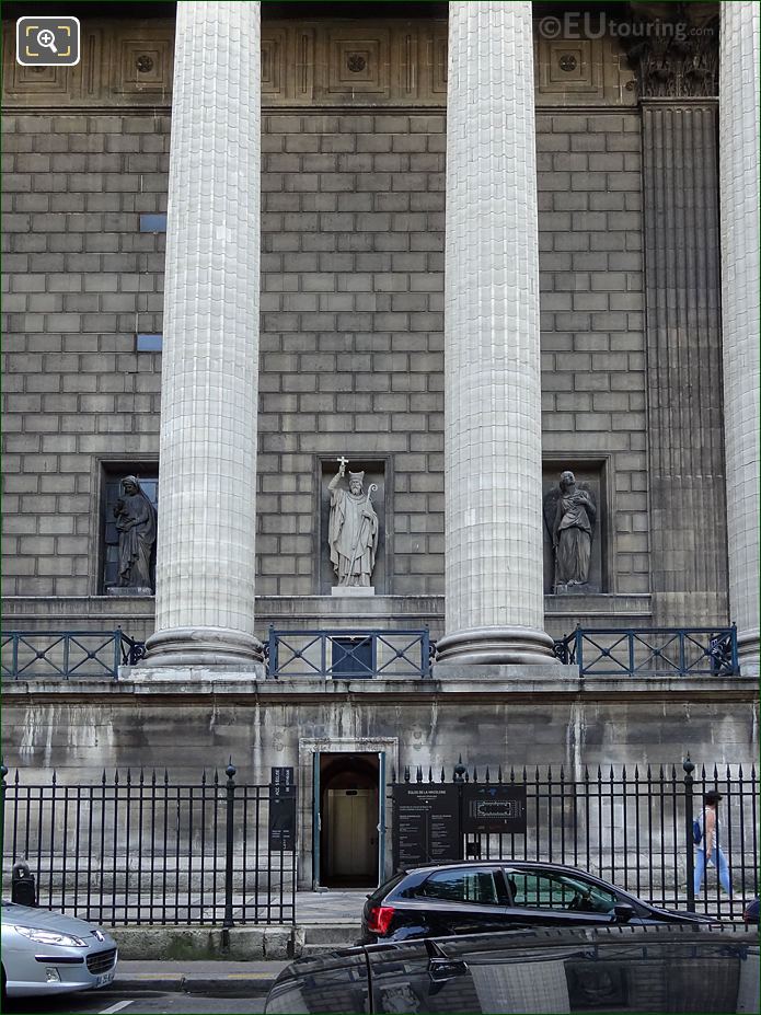 West facade Eglise de la Madeleine and Saint Denis statue with cross