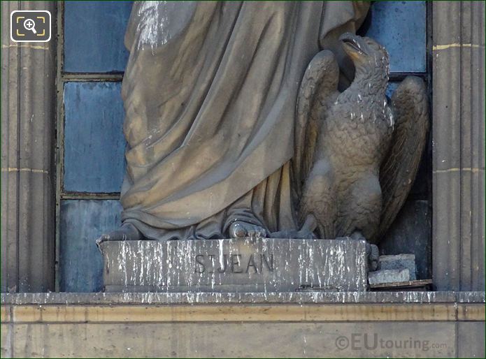Eagle and Saint Jean inscription on statue