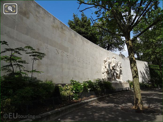 World War I monument with its curving stone wall RHS