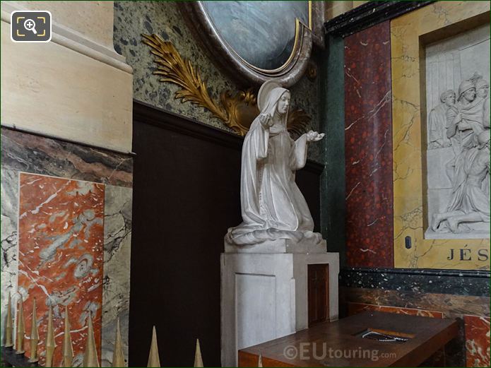 Eglise Saint-Roch marble statue of female Saint Kneeling