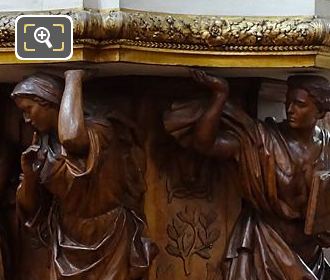 Wooden Caryatid sculptures supporting the vat in Eglise Saint-Roch