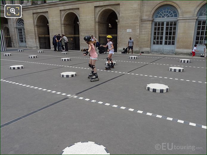 Smaller striped marble columns of modern art work at Palais Royal