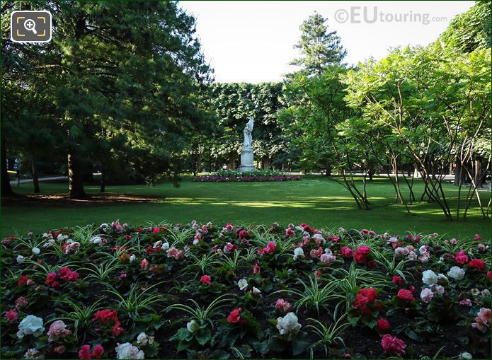 Leconte de Lisle statue with trees and flowers