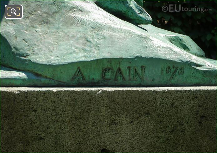 Artist name and year inscription on lion statue