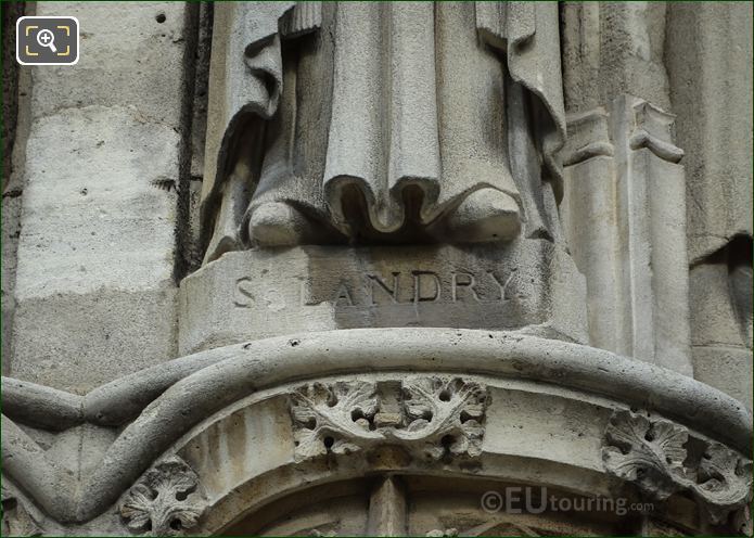 St Landry inscription on stone statue base