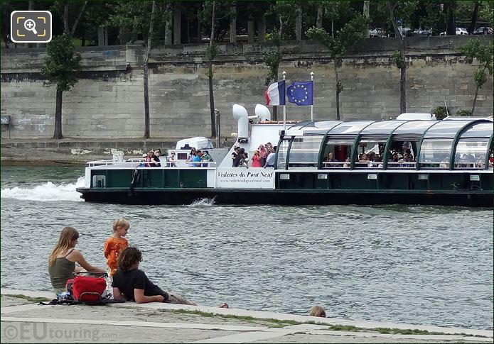 Vedettes du Pont Neuf with French and European flags